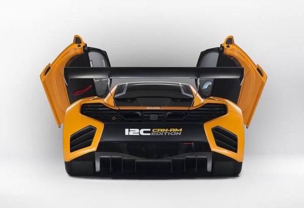 McLaren C122012, новый гоночный автомобиль концепкар. Новый McLaren GT, окрашен в чёрный с оранжевым цветом и смотрится шикарно. 